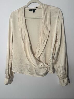 Ralph Lauren black label wrap blouse is crafted from a cream-colored silk-satin
